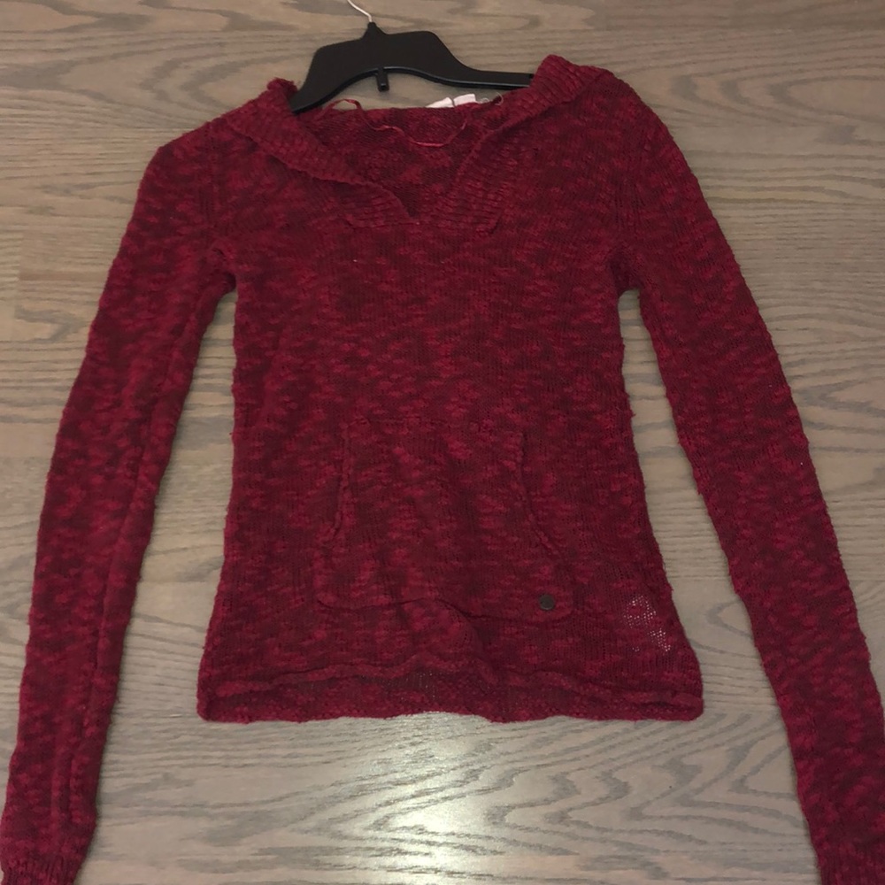 A red sweater/ hoodie.